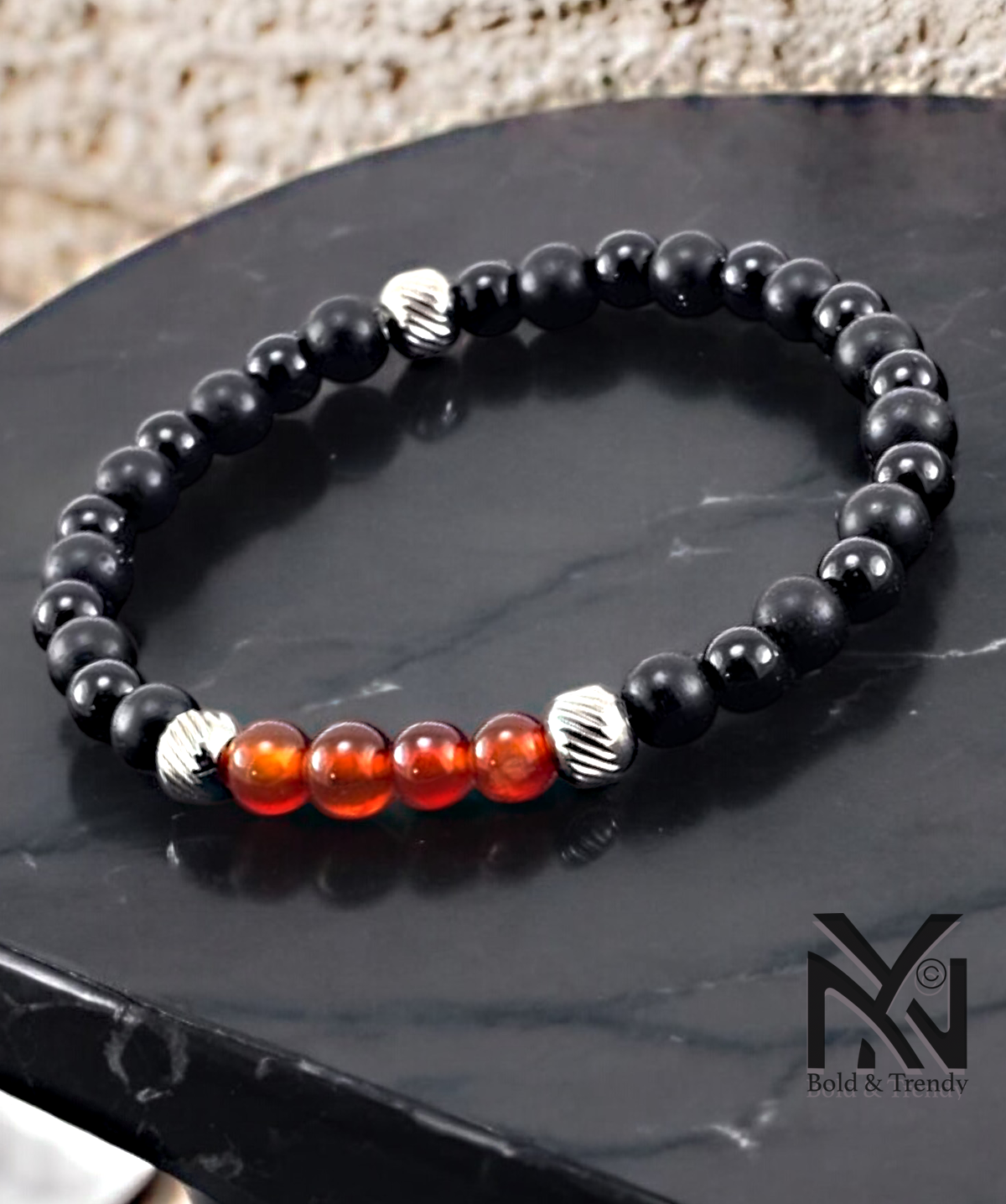 Ciel d'Automne bracelet featuring matte onyx and orange jade, promoting emotional healing and grounding